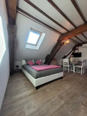 Un ou plusieurs lits dans un hébergement de l'établissement Au 1894 Loft