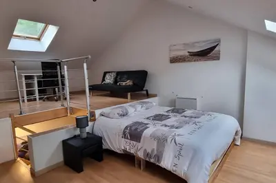 Un ou plusieurs lits dans un hébergement de l'établissement Maison de charme