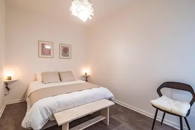 Un ou plusieurs lits dans un hébergement de l'établissement Charmant appartement à Épernay