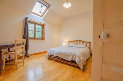 Un ou plusieurs lits dans un hébergement de l'établissement La ferme du chateau
