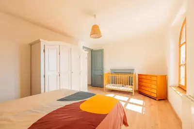 Un ou plusieurs lits dans un hébergement de l'établissement Gîte de la Louvière - maison de campagne