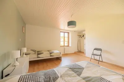 Coin salon dans l'établissement Gîte de la Louvière - maison de campagne