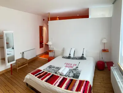 Un ou plusieurs lits dans un hébergement de l'établissement CHAMBRES D'HÔTES LA MADELEINE