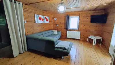 Télévision ou salle de divertissement dans l'établissement Le chalet du mazagran