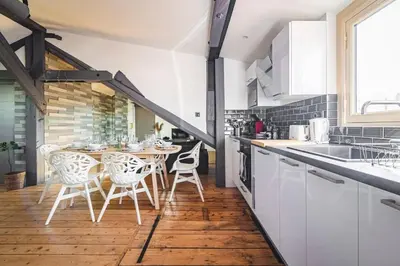 Cuisine ou kitchenette dans l'établissement Le nid Perché # reims