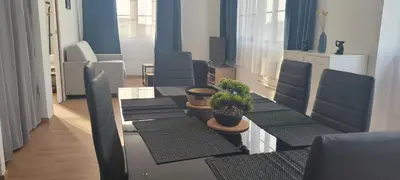 Coin salon dans l'établissement T2 neuf hypercentre 5 couchages