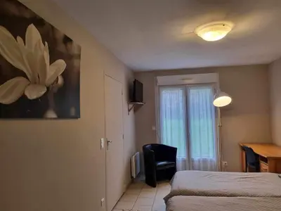 Un ou plusieurs lits dans un hébergement de l'établissement Auberge de la Forêt