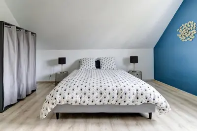 Un ou plusieurs lits dans un hébergement de l'établissement Gite de l'Oie - Maison avec grand jardin