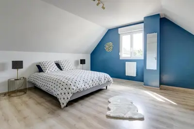Un ou plusieurs lits dans un hébergement de l'établissement Gite de l'Oie - Maison avec grand jardin