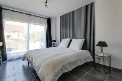 Un ou plusieurs lits dans un hébergement de l'établissement Gite de l'Oie - Maison avec grand jardin