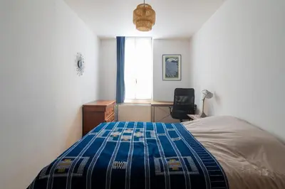 Un ou plusieurs lits dans un hébergement de l'établissement Appartement Meuse & Mono, en hyper centre