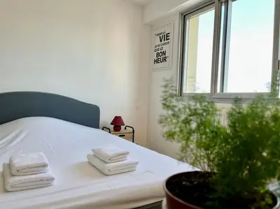 Un ou plusieurs lits dans un hébergement de l'établissement DOM' - Proche Arena Boulingrin