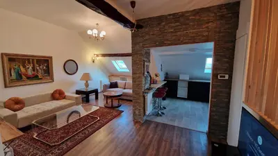 Télévision ou salle de divertissement dans l'établissement La Cigogne