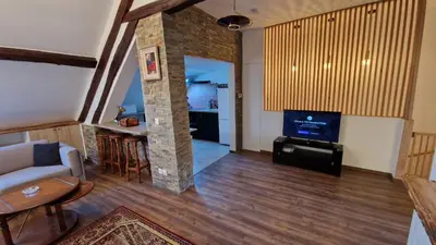 Télévision ou salle de divertissement dans l'établissement La Cigogne
