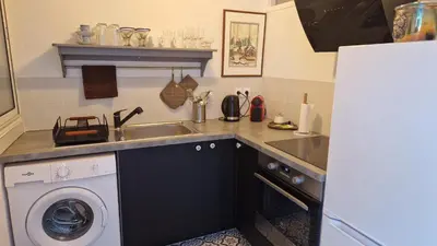 Cuisine ou kitchenette dans l'établissement Le Rossignol