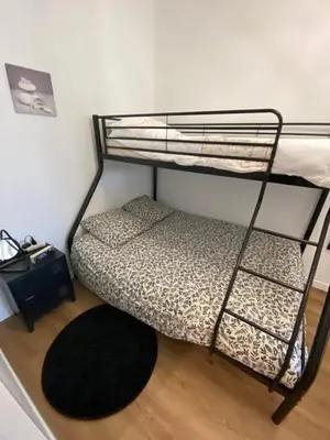 Un ou plusieurs lits dans un hébergement de l'établissement Le cocon de Didine, beau F2, 2 places de parking clos, proche Disneyland
