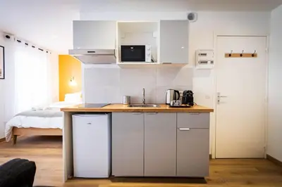 Cuisine ou kitchenette dans l'établissement L'Albatros 007 - Hypercentre * Cosy * Wifi