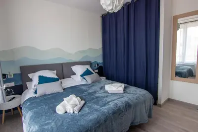 Un ou plusieurs lits dans un hébergement de l'établissement Cocon d'Hiver - Netflix & Wifi - Parking Gratuit - check-in 24H24 - Kit Bébé disponible sur demande - Emplacement Vélos - GoodMarning