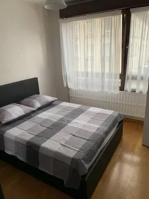Un ou plusieurs lits dans un hébergement de l'établissement Reims centre-ville -au1er étage avec 2 chambres - 6 personnes