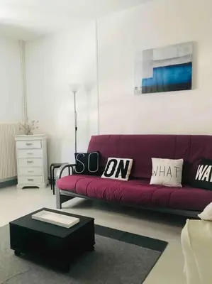 Coin salon dans l'établissement REIMS - Duplex au cœur du quartier Saint-Remi