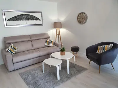 Coin salon dans l'établissement Magnifique appartement avec garage privé et terrasse