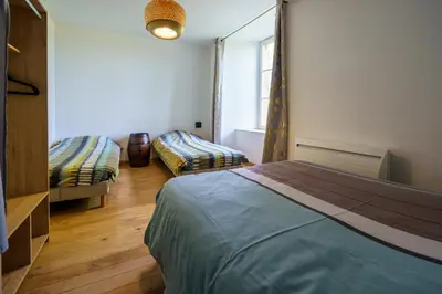 Un ou plusieurs lits dans un hébergement de l'établissement Les gîtes Saint-Aignan