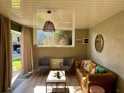 Coin salon dans l'établissement Le Petit Chateau