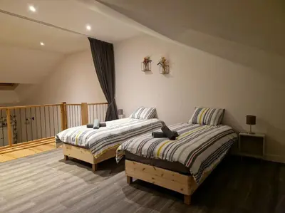 Un ou plusieurs lits dans un hébergement de l'établissement Gîte de l'étoile, 6 pers. spacieux avec extérieur