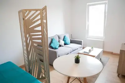 Coin salon dans l'établissement Stud confort centre ville 4pers