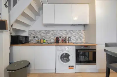Cuisine ou kitchenette dans l'établissement Triplex cosy