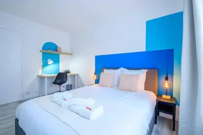 Un ou plusieurs lits dans un hébergement de l'établissement Blue Paradise