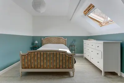 Un ou plusieurs lits dans un hébergement de l'établissement Villa Jeannot - Maison avec jardin