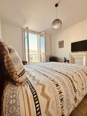 Un ou plusieurs lits dans un hébergement de l'établissement Studio de la Belle Vue