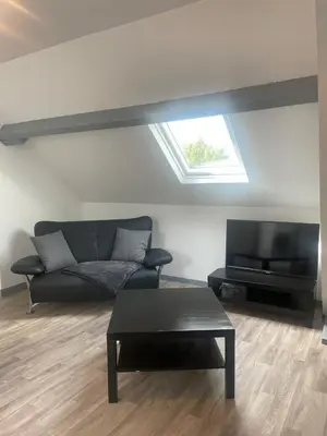 Coin salon dans l'établissement Superbe loft neuf - 1 chambre- face au Château - RIMBAUD