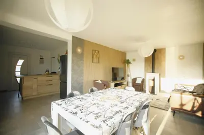 Coin salon dans l'établissement Magnifique Maison de plain-pied Neuf
