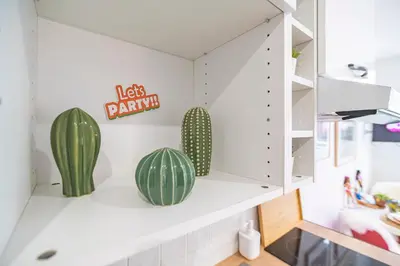 Cuisine ou kitchenette dans l'établissement ExploreReims - Malibu beachhouse proche gare et centre