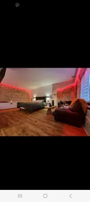 Coin salon dans l'établissement Romantique room