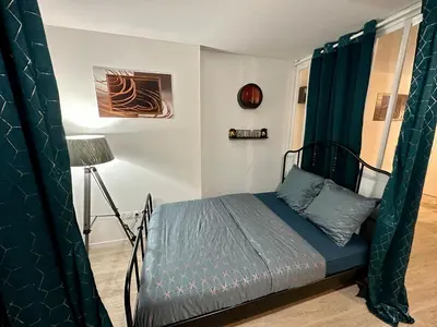 Un ou plusieurs lits dans un hébergement de l'établissement Appartement avec vue sur jardin Paris-Disney-Parking privé 'PKN MEAUX'