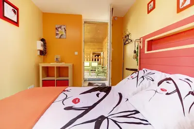 Un ou plusieurs lits dans un hébergement de l'établissement La Petite Maison Du Montjard