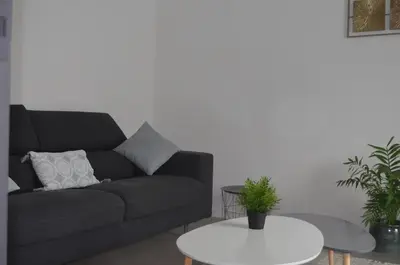 Coin salon dans l'établissement Agréable maison petit jardin à 7 minutes de Reims