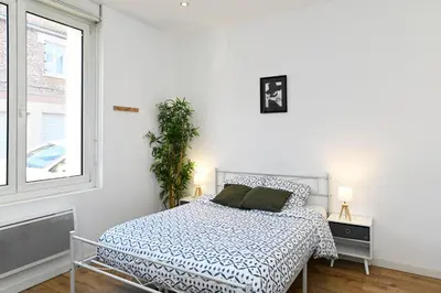 Un ou plusieurs lits dans un hébergement de l'établissement TC Residences - Charmant Appartement