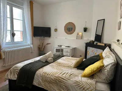 Télévision ou salle de divertissement dans l'établissement Au Cosy Garden