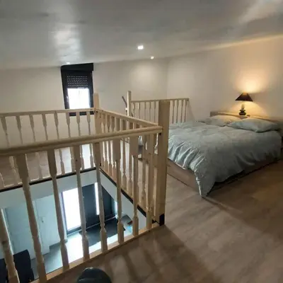 Un ou plusieurs lits dans un hébergement de l'établissement Loft entier, calme, fibre et wifi