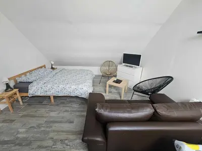 Télévision ou salle de divertissement dans l'établissement Studios du Cèdre