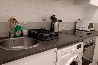 Cuisine ou kitchenette dans l'établissement Appartement T2 à 35min de Paris & 20min de Disney à Saint Jean
