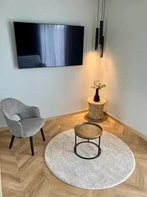 Télévision ou salle de divertissement dans l'établissement Le Clos des Huy Prés
