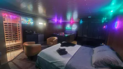 Un ou plusieurs lits dans un hébergement de l'établissement L&A Spa privatif