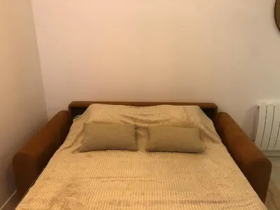 Un ou plusieurs lits dans un hébergement de l'établissement Maisonnette au cœur du vignoble