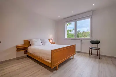 Un ou plusieurs lits dans un hébergement de l'établissement Maison proche Disney/Parking gratuit