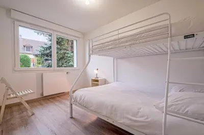 Un ou plusieurs lits dans un hébergement de l'établissement Maison proche Disney/Parking gratuit